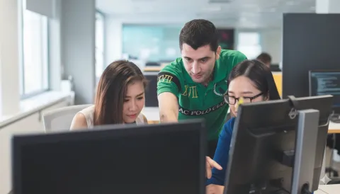 Students reviewing progress on the latest project. 